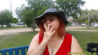 Nurse Vicki Smoking in the Park on a Bench All Dressed up